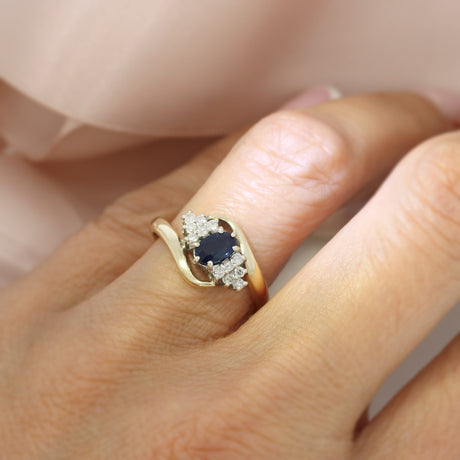 Pre Owned 9ct Yellow Gold Oval Sapphire & Diamond Cluster Ring in a Crossover Setting