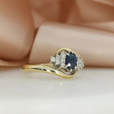 Pre Owned 9ct Yellow Gold Oval Sapphire & Diamond Cluster Ring in a Crossover Setting