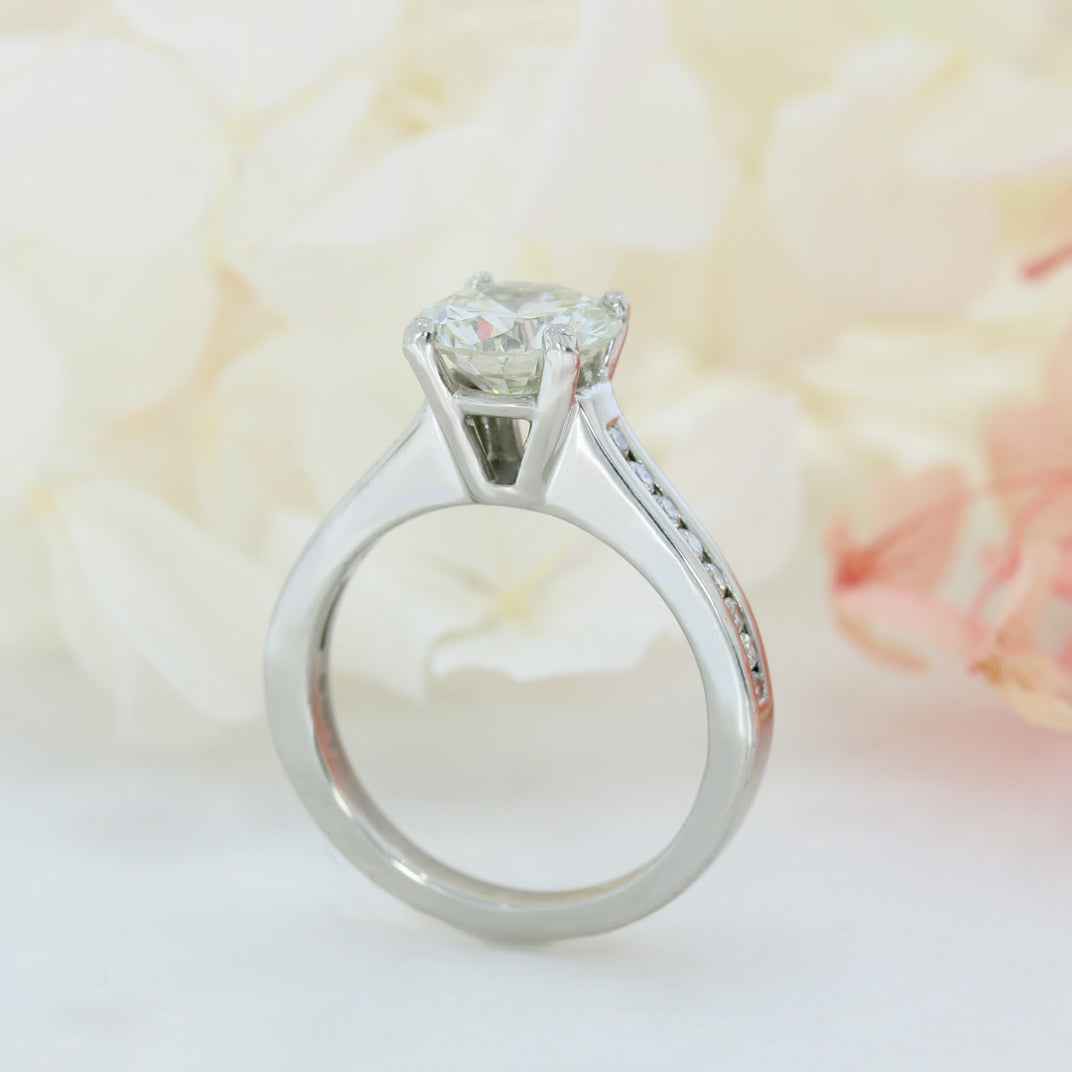 Pre Owned Platinum Natural Diamond Solitaire Ring with Channel Set Shoulders