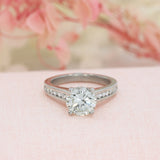 Pre Owned Platinum Natural Diamond Solitaire Ring with Channel Set Shoulders