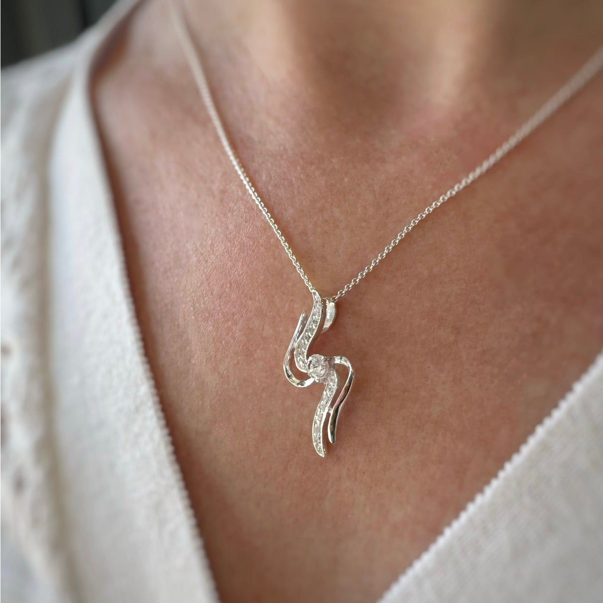 Silver 2 S Shape Ribbons With Centre CZ Pendant