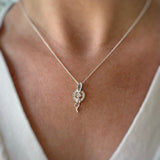 Silver Cubic Zirconia Pave Set Circle with Silver Ribbons
