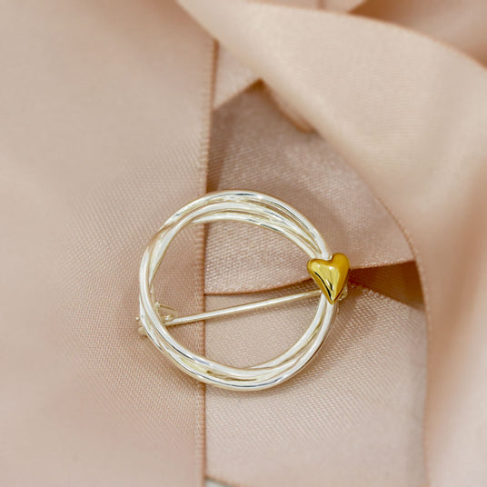 Silver Twisted Circle Brooch with Gold Plated Heart Detail