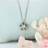 9ct White Gold Diamond Flower Pendant on Curb Chain