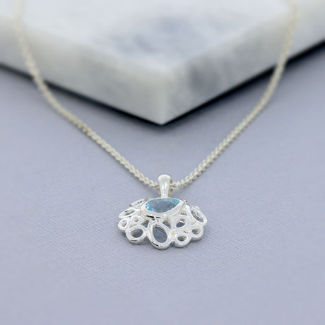 Silver Fancy Pendant With Pear Shape Blue Topaz & Chain