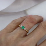 18ct Yellow Gold Oval Emerald & Round Diamond Three Stone Ring