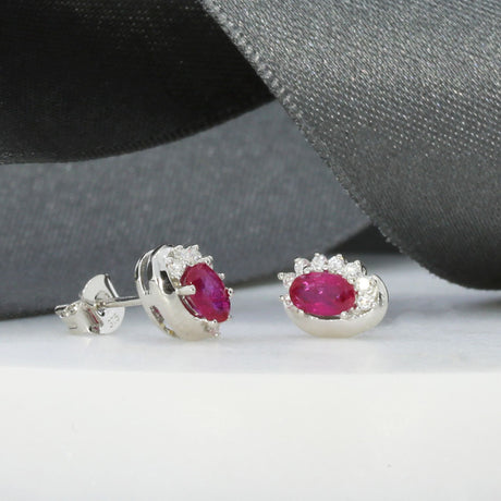 9ct White Gold Oval Ruby Earrings With Claw Set Diamonds