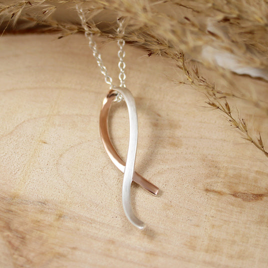 Silver Ribbon Style Pendant with Rose Gold Accent