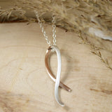 Silver Ribbon Style Pendant with Rose Gold Accent