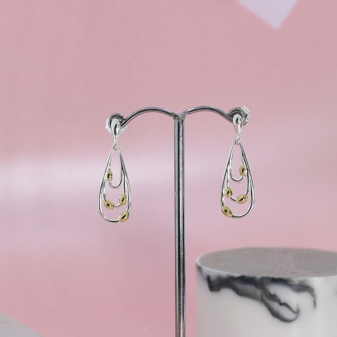 Silver and Yellow Gold Three Tiered Teardrop Shaped Drop Earrings