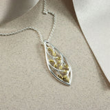 Silver Marquise Shape Open Leaf Pendant With Yellow Gold Accent
