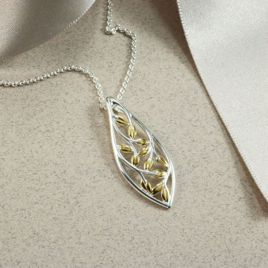 Silver Marquise Shape Open Leaf Pendant With Yellow Gold Accent