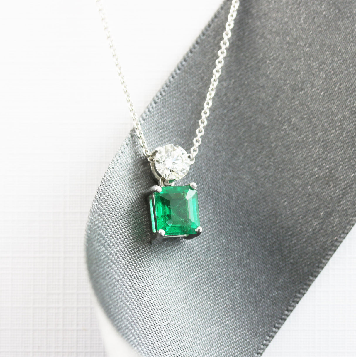 18ct White Gold Emerald & Diamond Pendant