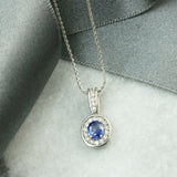 18ct Gold Sapphire & Diamond Halo Pendant & Chain