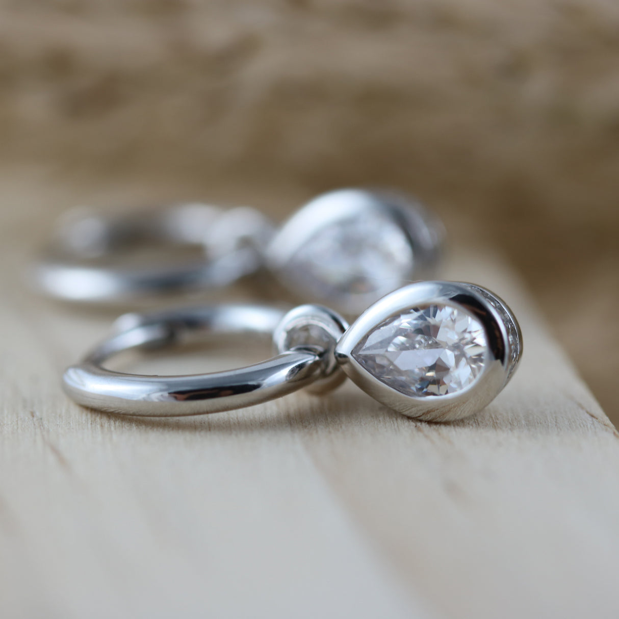 Silver Small Hoop Earrings With Pear Shape Drop